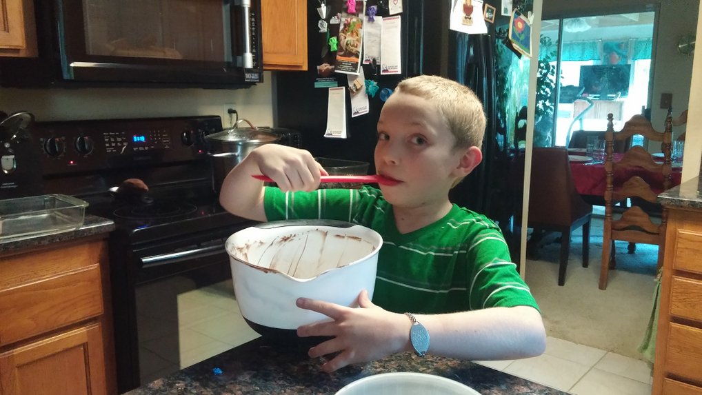 Licking the birthday cake bowl