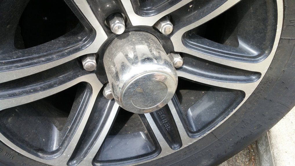 remove plastic cap on axle