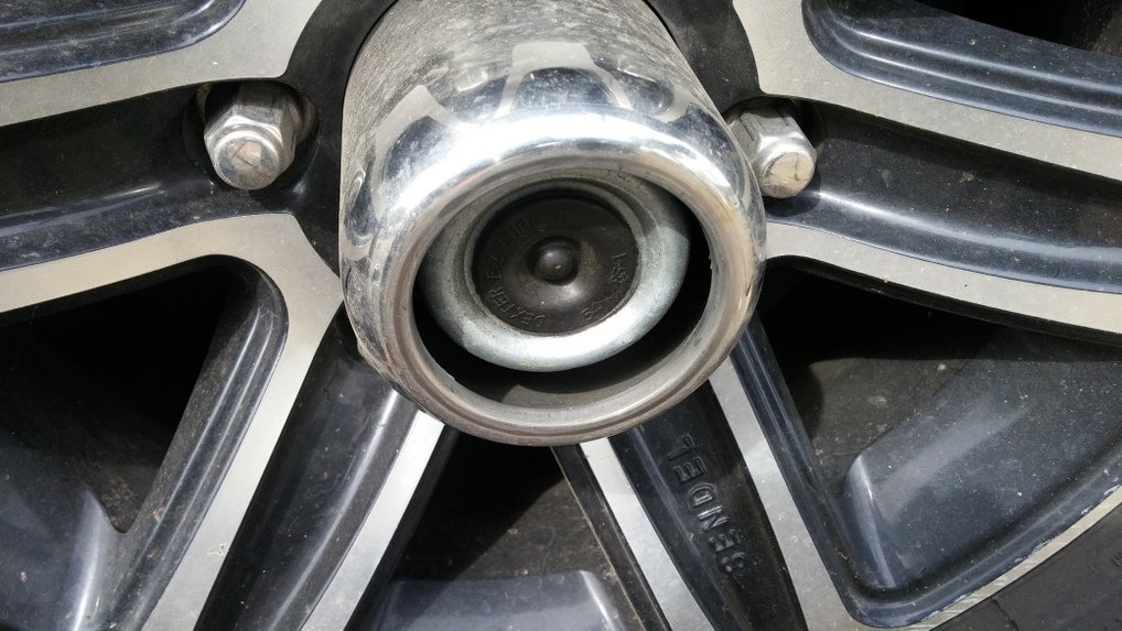 remove rubber cap on axle