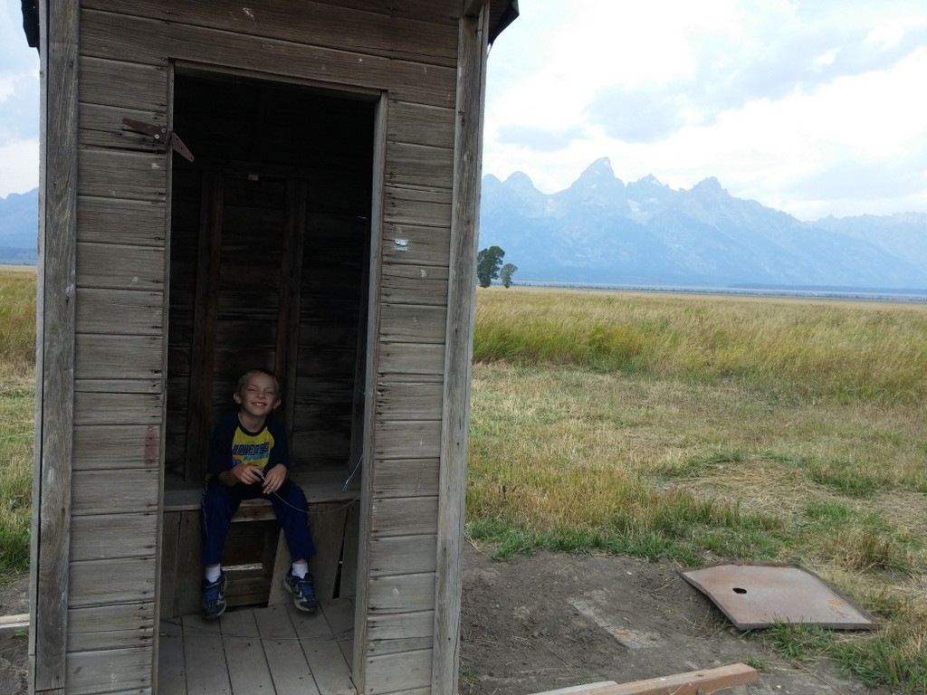 Trying out the old outhouse on Mormon Row