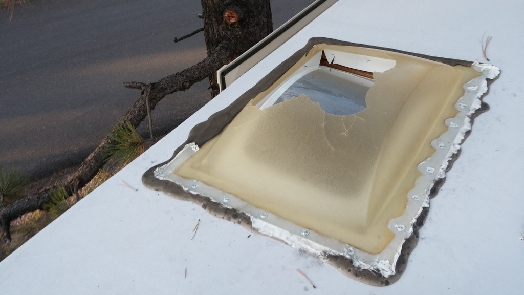 Tearing the sealing gunk off the broken skylight